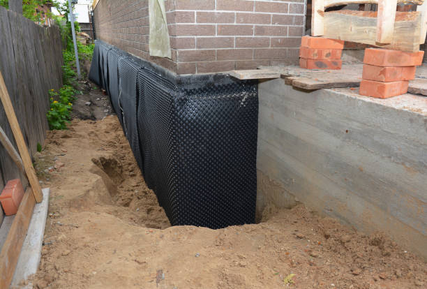 SJ Waterproofing Pros technician performing targeted Emergency Waterproofing assessment in South Rockwood, MI